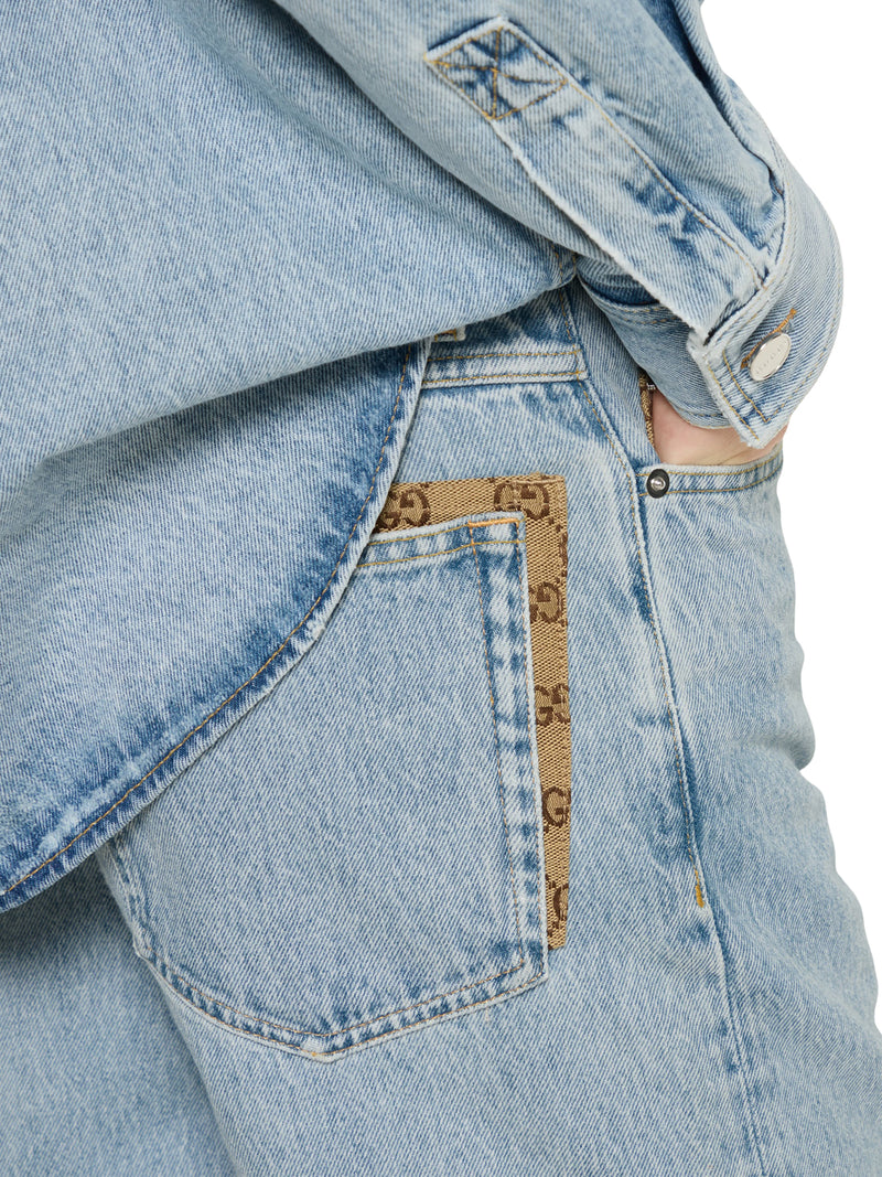 PANTALONE IN DENIM DÉLAVÉ CON INSERTO GG