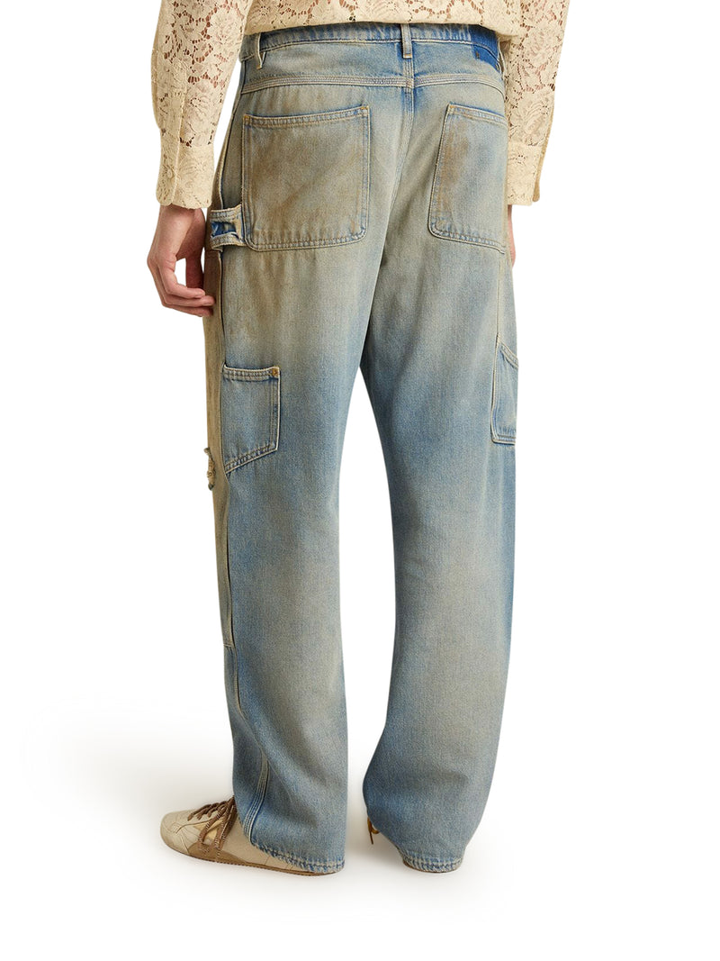 JEANS CON LAVAGGIO SABBIA DALL`EFFETTO DISTRESSED
