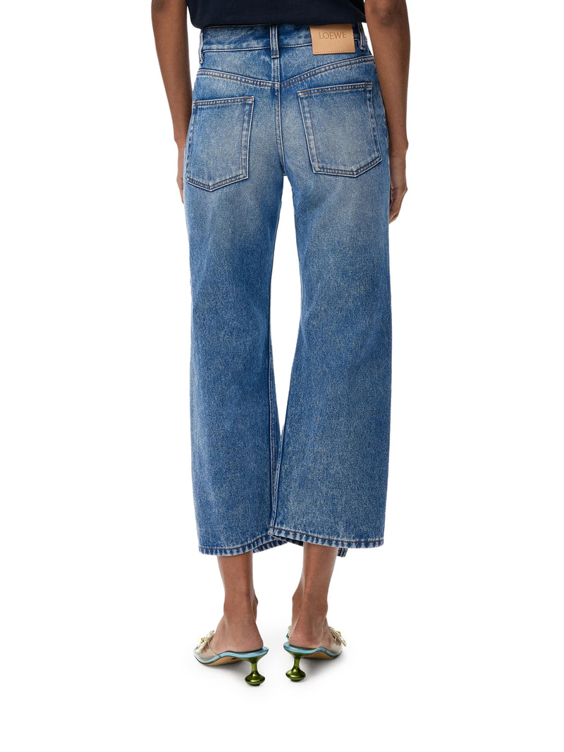 PANTALONI IN DENIM CON GAMBA SVASATA E SPACCHI LATERALI
