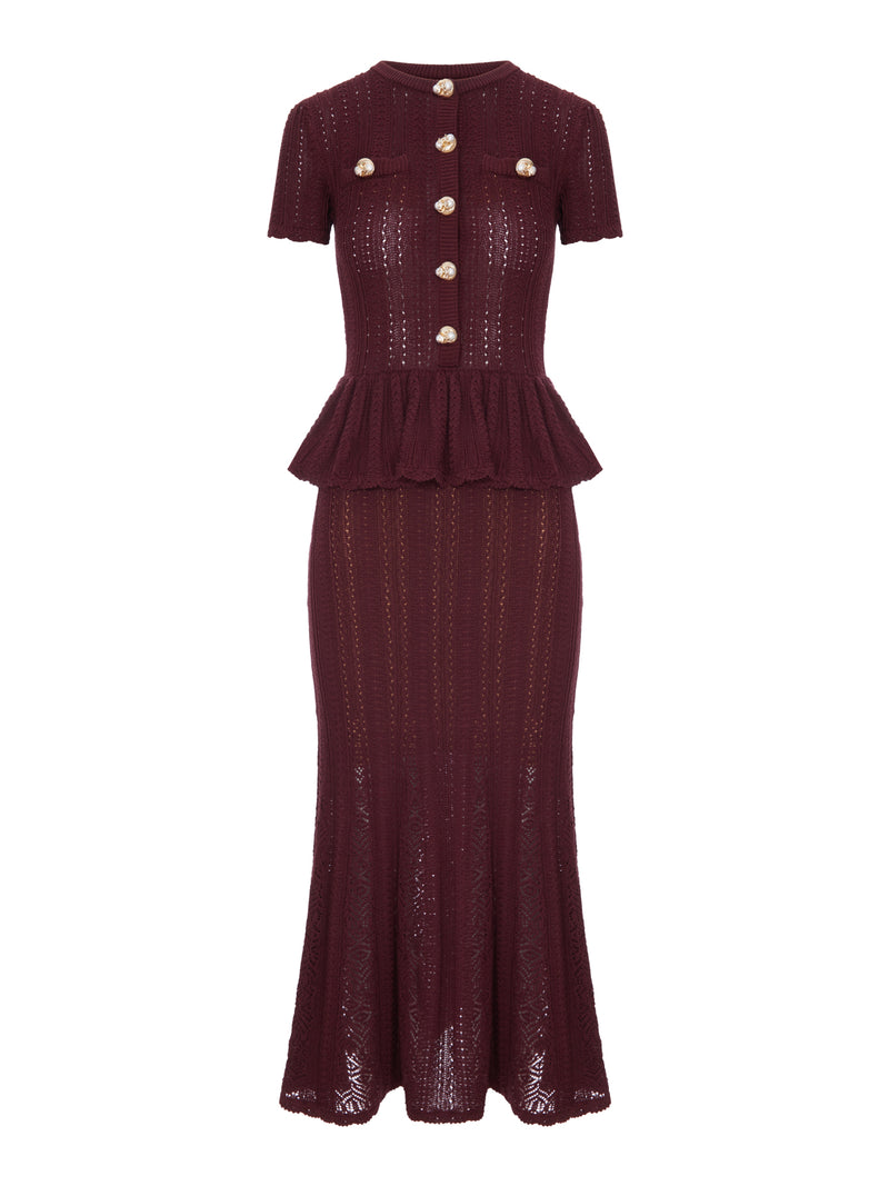 ABITO LUNGO IN MAGLIA TRAFORATA CON PEPLUM E BOTTONI GIOIELLO