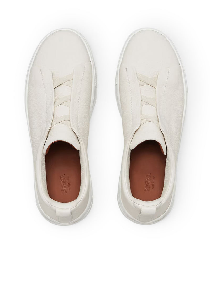 SNEAKER TRIPLE STITCH™ IN PELLE DI CERVO CREMA