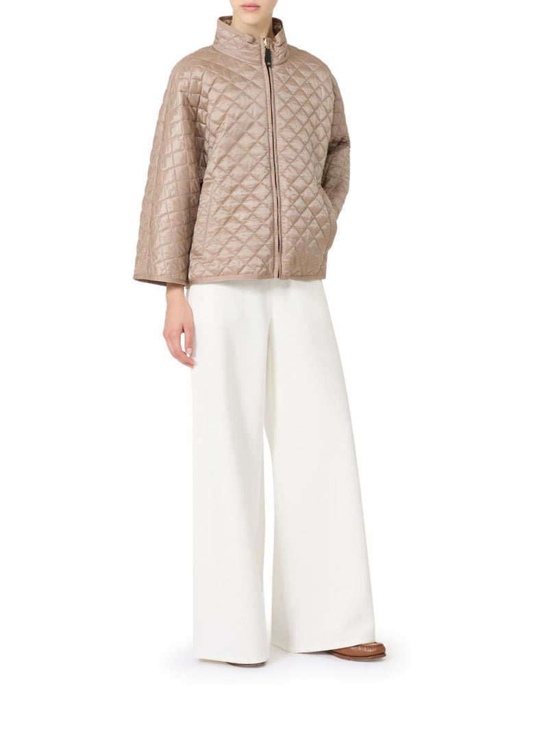 CAPPA REVERSIBILE IMBOTTITA IN TELA ANTIGOCCIA