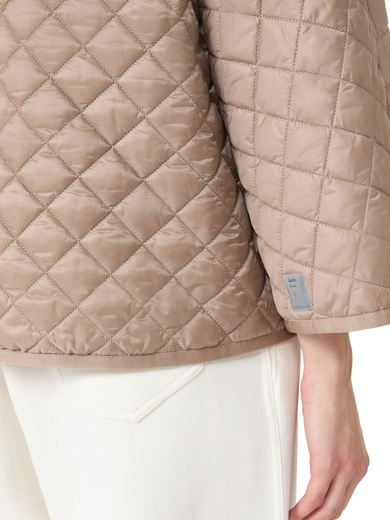 CAPPA REVERSIBILE IMBOTTITA IN TELA ANTIGOCCIA