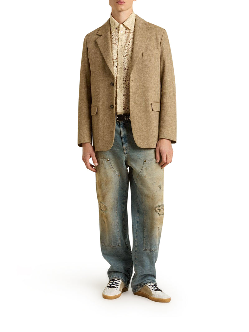 JEANS CON LAVAGGIO SABBIA DALL`EFFETTO DISTRESSED