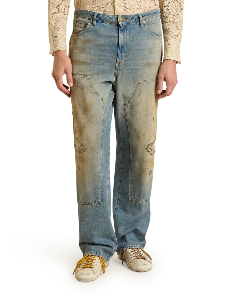 JEANS CON LAVAGGIO SABBIA DALL`EFFETTO DISTRESSED