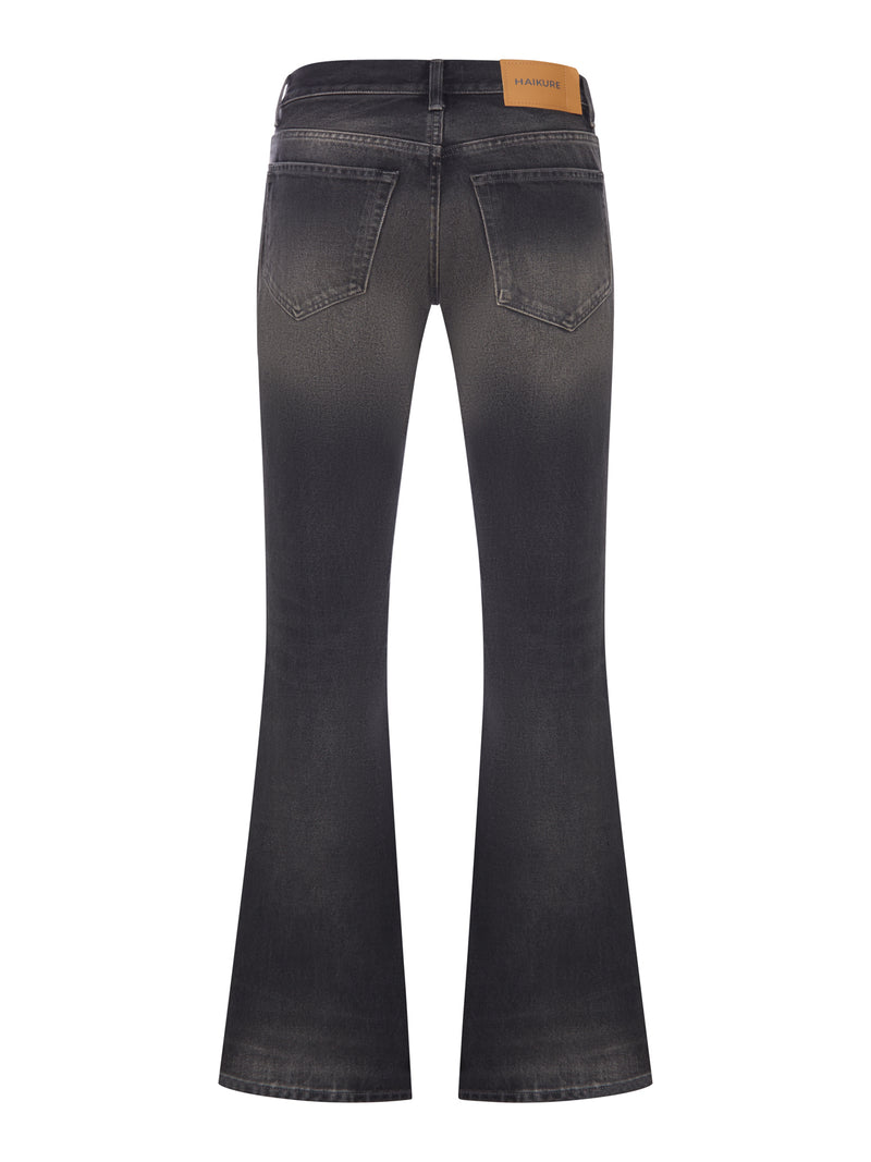 JEANS FLARE IN DENIM LAVATO CON TASCHE